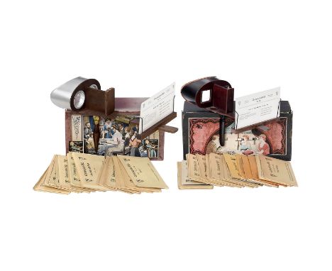 2 System-Holmes-Stereobetrachter, um 1910Für Stereokarten 9 x 18 cm, jeweils in Original-Schachtel mit Farblithographie auf d