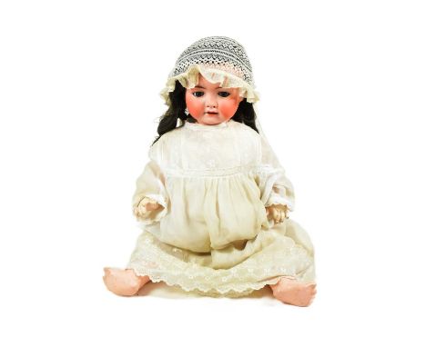 Dolls - an early 20th Century German Heubach Koppelsdorf bisque headed doll. Blue flirty eye, finely painted brows and lashes