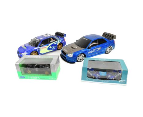 Diecast - x2 boxed diecast models of Subaru interest comprising Welly / NEX Models 1/24 scale Subaru Impreza WRX STI and a Li