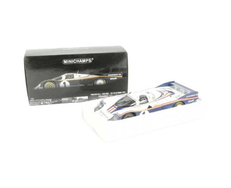 Diecast - a boxed Minichamps made 1/18 scale diecast model Porsche 956L signed by Derek Bell and Jacky Ickx winner of Le Mans