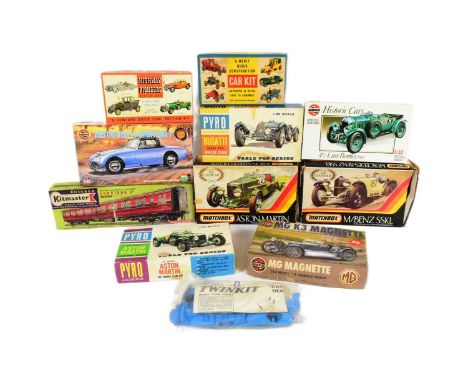 Model Kits - a collection of assorted plastic model kits of automobilia interest to include; Matchbox Aston Martin, Airfix MG