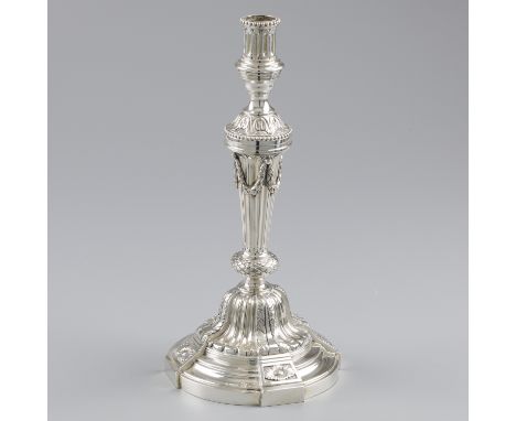 Louis XVI style silver candlestick. A beautiful heavy candlestick in Louis XVI style with a.o. garlands, leaves, pearl rims a