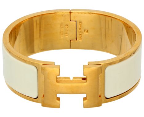 Hermès Bracelet Clic H white. Gold-plated with white enamel. In good condition. Signed Hermès, numbered: SP 0139, Made in Fra