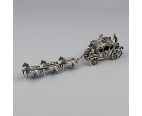 Miniature royal carriage silver. Equipped with six horses and many details including a footman and a crown on the roof of the