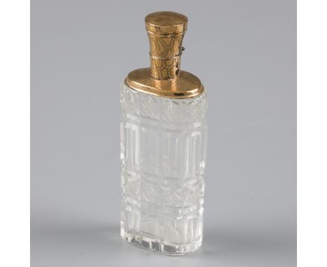 Perfume bottle, gold. Beautiful model with crystal cut glass holder and a gold frame and cap with engraved decorations. Also 