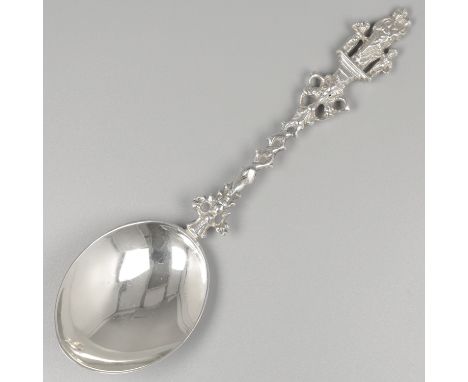 Silver occasional spoon. Model crowned with the image of the charity (Charitas) carried by two dolphins. The stem is partly t