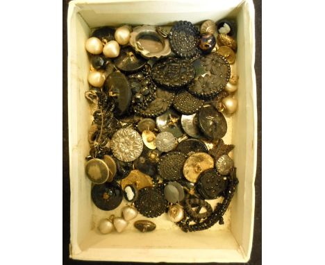 A good quantity of buttons to include some jet examples, yellow metal studs with enamel decoration and other items