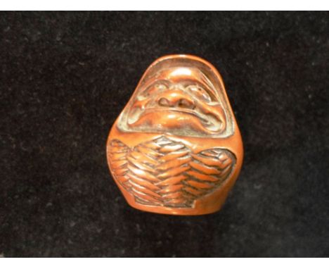 A Meiji period carved hard wood netsuke of a stylised old man, 3.3cm, unsigned