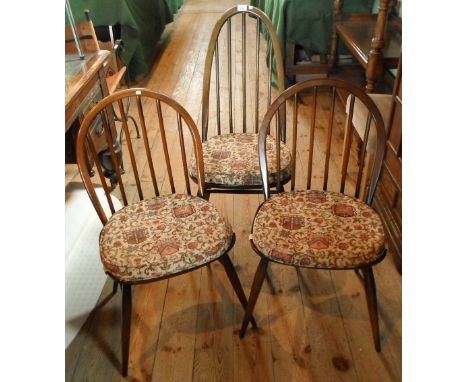 A set of eight ercol style dining chairs, two large and six standard
