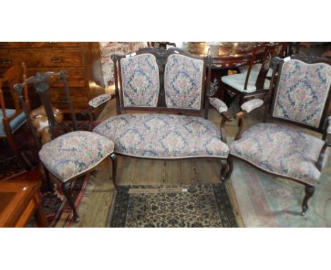 A Victorian mahogany nine-piece salon suite comprising a two-seater sofa, two armchairs, four chairs and two nursing chairs, 