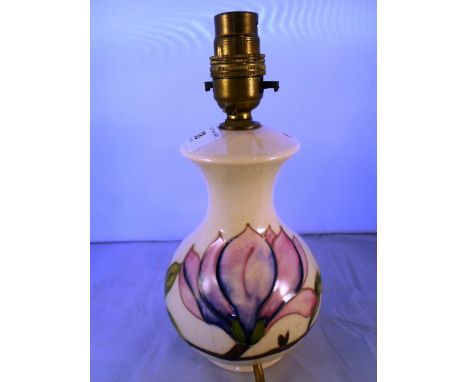 A Moorcroft small table lamp with pink flowers on an ivory ground, impressed marks to base, 24cm (to include fitting)