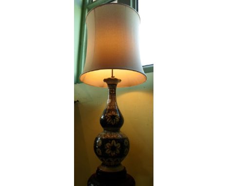 A 20th century traditional tribal Sarawak design ceramic double gourd florally decorated table lamp, having telescopic moveme