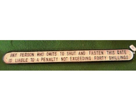 A cast metal railway sign, 'Any person who omits to shut & fasten this gate is liable to a penalty not exceeding forty shilli