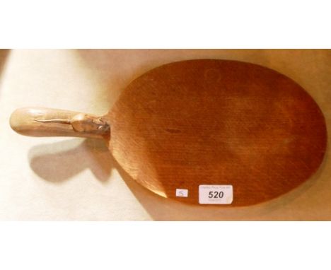 A Robert Thompson, Mouseman, cheese board, of oval shape having carved mouse to handle, 37cm long 