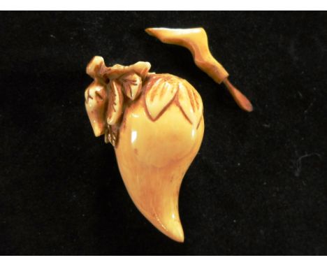 A late 19th century Japanese carved ivory netsuke shaped as a fruit, the stalk formed as a removable spoon, 7cm, unsigned