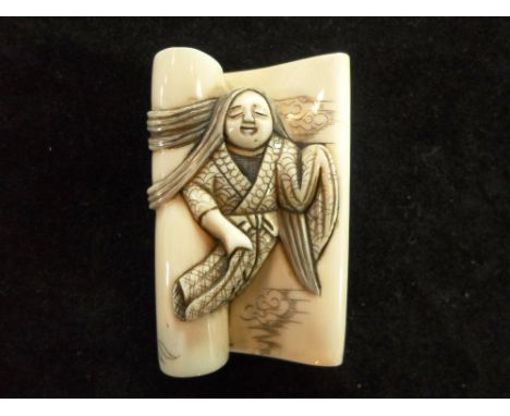 A Meiji period ivory carved netsuke formed as a 'dream lady' with etched flower decoration, 5.5cm x 3.6cm, signed