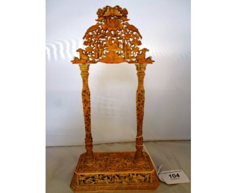 A mid to late 19th century elaborately carved watch holder (lacking hook), modelled as a Chinese gate, having pierced crestin