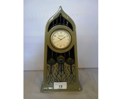 A Moorcroft mantel clock with peacock feather design, in the art nouveau manner, impressed & painted marks to base, 13cm