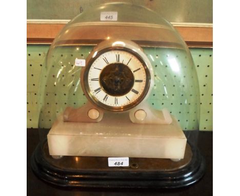 A Victorian alabaster mantel clock, under dome, the enamel dial having roman numerals with the works partially visible, 33cm 