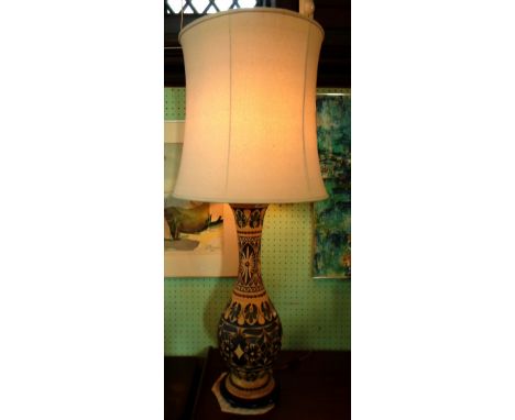 A large 20th century traditional tribal Sarawak design table lamp of floral & geometric painted design, 82cm