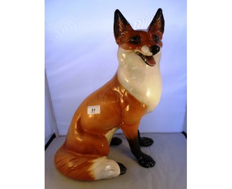 A large ceramic model of a seated fox, made in Italy, 20th century, marked Ronzan, 42cm tall