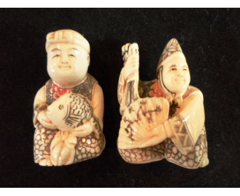 Two late Meiji period carved ivory netsuke, each of man, one holding a fish and the other a fan, 4.6cm & 4.4cm tall, both sig