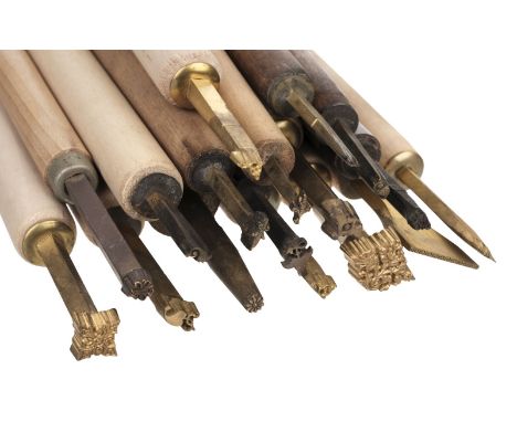 * Finishing tools. A collection of 34 decorative finishing tools, comprising 23 decorative centre &amp; corner finishing tool