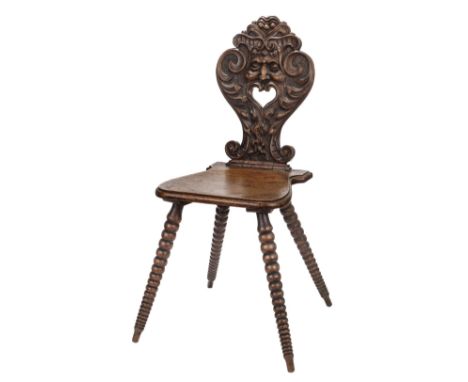 * Card Table Chair. An unusual Victorian chair, with shaped seat, bobbin legs, and carved grotesque back with bearded visage,