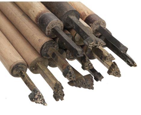 * Decorative finishing tools. 50 brass decorative finishing tools, including centre and corner tools, including simple orname