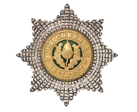 Cheshire Regiment Officer's cap badge by Firmin, London.  Fine die-cast silvered facetted star mounted with rich gilt title c