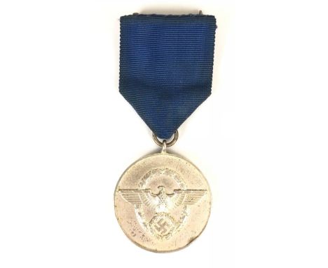 German Third Reich Police 8 year Service Medal.  Good silvered example bearing wreath this eagle and swastika to centre to ob