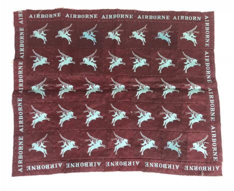 WW2 Airborne insignia cloth souvenir. Superb and unusual item comprising 35 printed Pegasus Airborne formation signs sewn tog