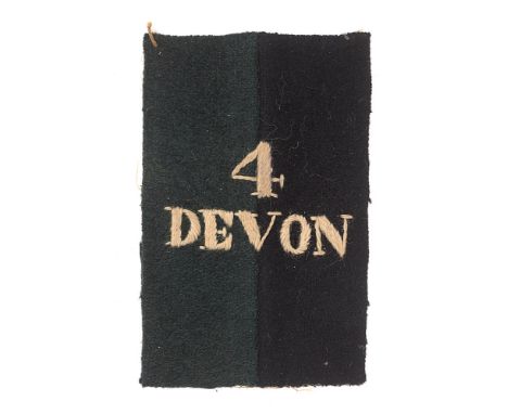 4th Battalion Devonshire Regiment WW1 Foreign Service Helmet cloth pagri badge.  Good scarce upright dark green and black fel