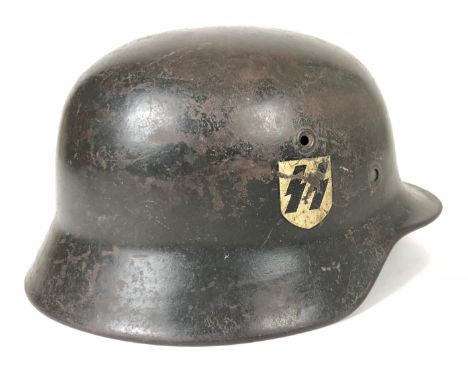 German Third Reich M40 Waffen SS single decal steel helmet.  Good scarce rolled edge example retaining SS runes decal to left