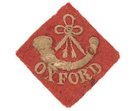 Oxfordshire Light Infantry pre 1908 cloth pagri flash.  White bugle over OXFORD embroidered on red diamond.      Worn and fad