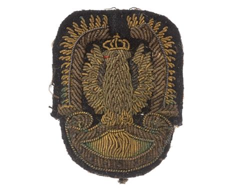 WW2 Polish Air Force Officer's cap badge.  Scarce padded bullion crowned eagle resting on Amazon shield and flanked with Drag