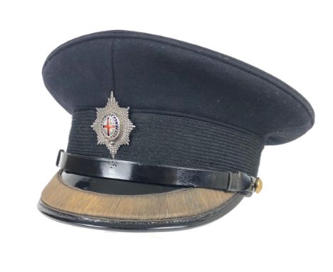 Coldstream Guards Officer's peaked forage cap  bearing silver badge.  Dark blue melton cloth body with leather peak decorated