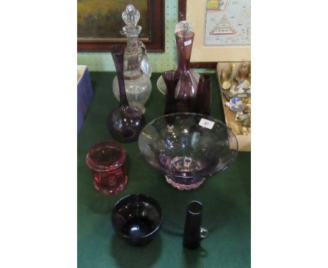 A collection of seven items of coloured glass, together with silver plated decanter, ship's decanter and one other.