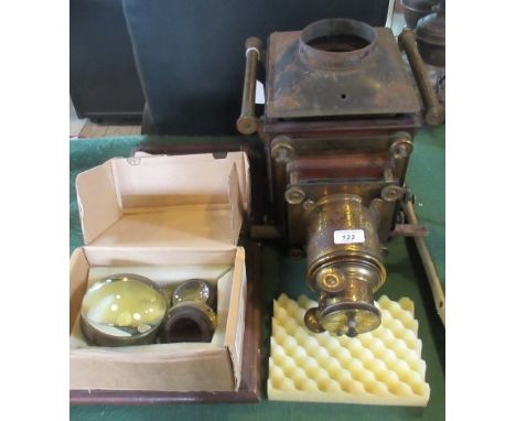 A 19th century mahogany and brass magic lantern (incomplete), together with four lenses.