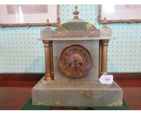 An onyx and gilt mounted mantle clock in the neo classical style.