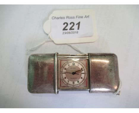A Morado Art Deco white metal bag watch, rounded rectangular opening to reveal square dial with Arabic numerals, calibrated s