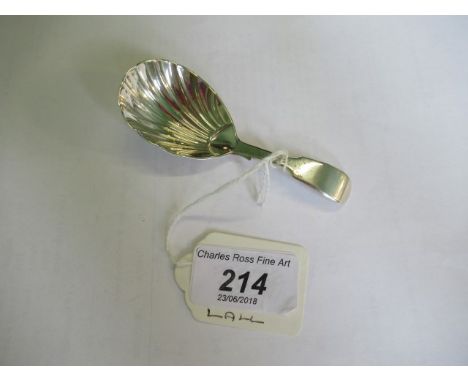 A silver caddy spoon of shell shaped form, London 1862 George W Adams for Chaucer & Co.