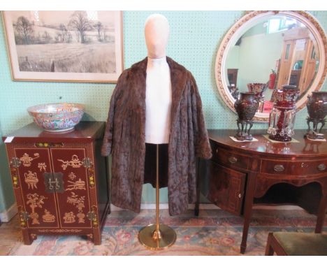 A full length fur coat.