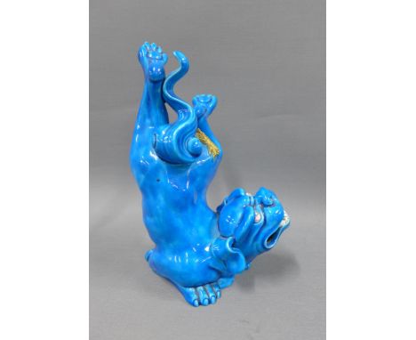 Royal Worcester turquoise glazed Temple lion, repair to leg, impressed factory backstamp, 21cm (a/f) 