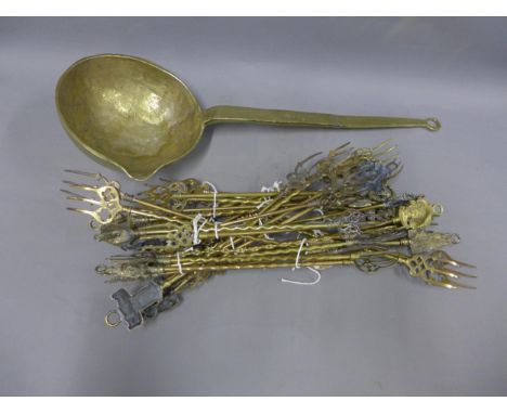 Large brass ladle, 73cm,  and a quantity of brass toasting forks, (a lot) 
