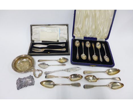 Cased set of six Sheffield silver teaspoons, five Georgian silver teaspoons, Epns spoons, tea strainer and decanter label etc
