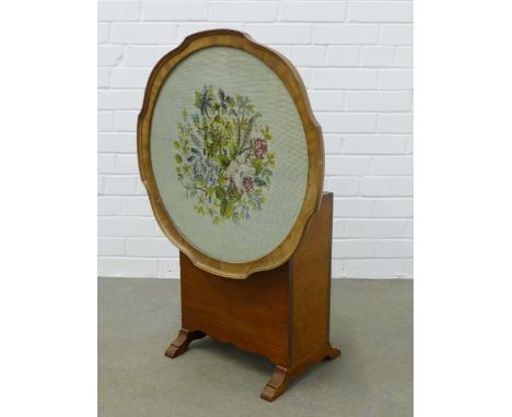 Early 20th century magazine rack / table with glazed pie crust edge top containing a floral embroidered panel within a pie cr