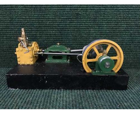 A hand-built steam engine on wooden stand