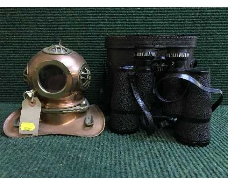 A set of cased Pathescope binoculars and a miniature copper and brass diver's helmet  