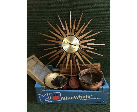 A box of teak sun burst clock, wash board, kitchen scales, weights, copper planter, pipe etc 